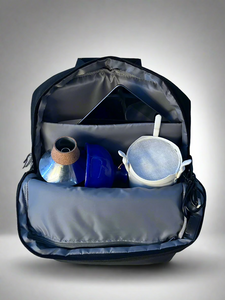 open backpack with ipad and mutes